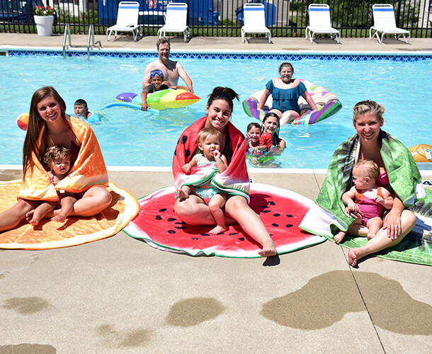 manufactured home community residents enjoying the pool